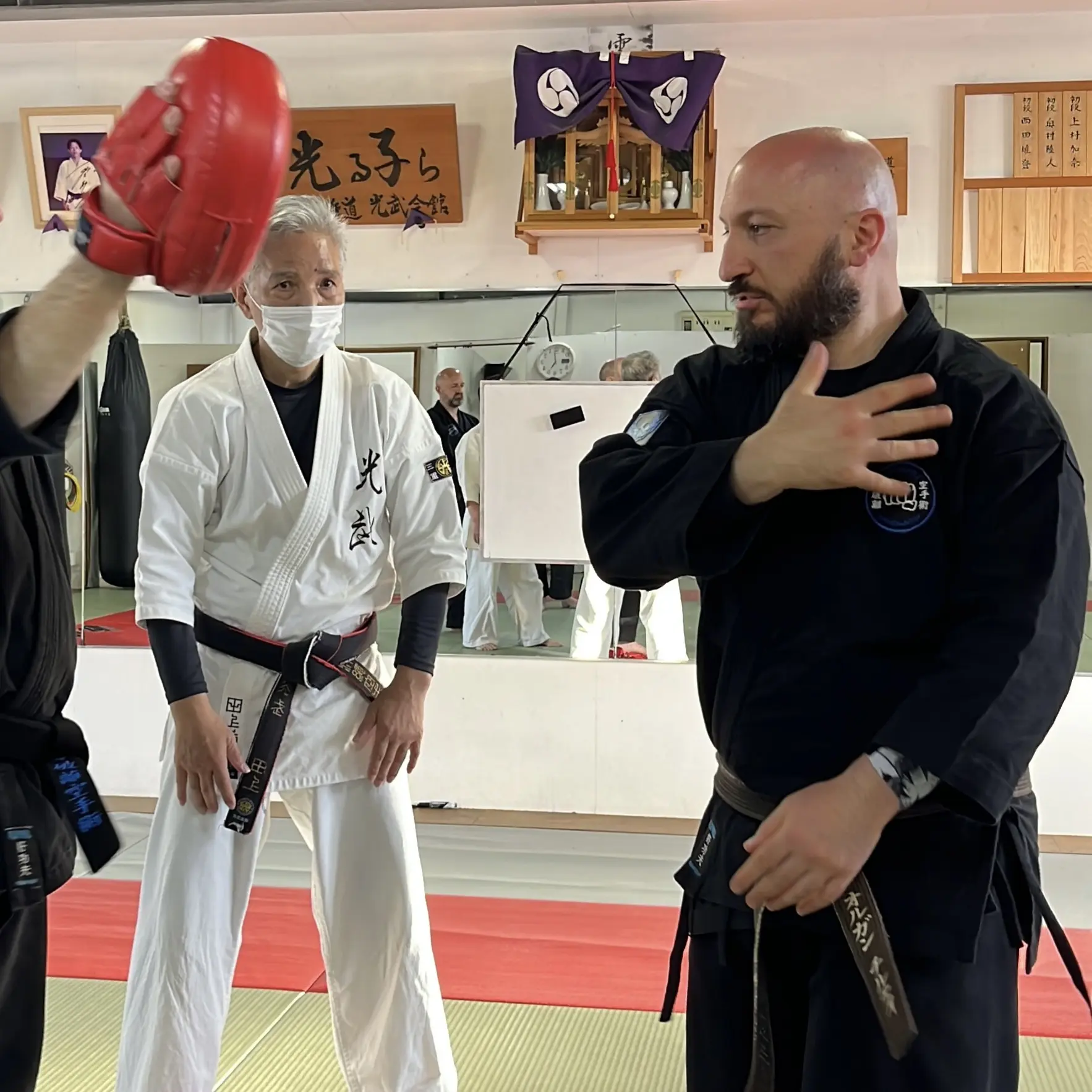 Olgun Tiltay learning slap variations from Nobuya Tagami Sensei [9th Dan Tomarite Karate] in Ise Japan